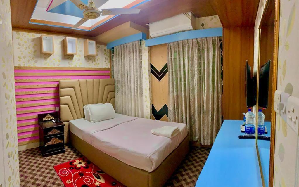 Hotel Blue Bird Daca Quarto foto